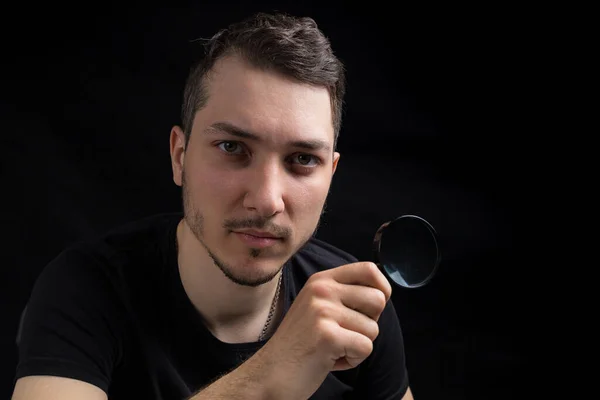 Young Handsome Man Magnifying Glass Black Background Low Key Search — Stock Photo, Image