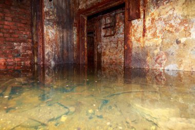 Flooded disguised secret military bunker. Abandoned bomb shelter. Background clipart