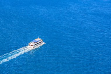 White boat sailing on clear blue ocean water. August 12, 2025 Istanbul Turkey.