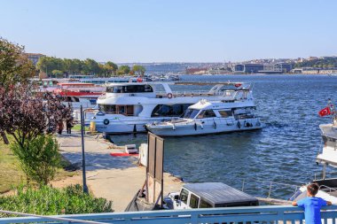 White yachts docked on sunny day at a beautiful waterfront with clear blue sky. August 12, 2025 Istanbul Turkey.