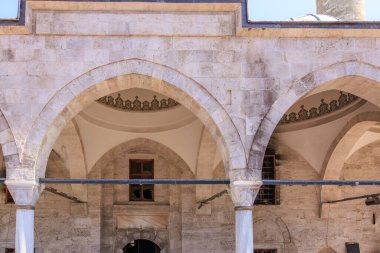 Historic ottoman stone architecture with elegant arches and intricate patterns.