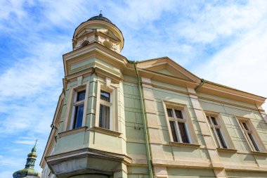 Historic european building with tower and sky background.