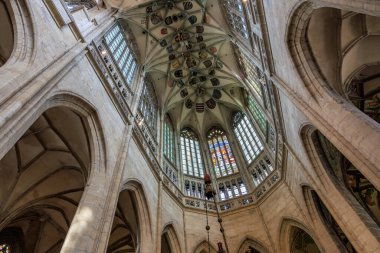 Gothic cathedral interior with stained glass and arched ceilings.. March 22, 2025, Kutna Hora, Czech Republic.