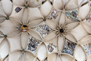 Ornate medieval vaulted ceiling with intricate heraldic designs.. March 22, 2025, Kutna Hora, Czech Republic.