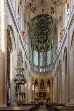 Gothic cathedral interior with stained glass and sculptures.. March 22, 2025, Kutna Hora, Czech Republic.