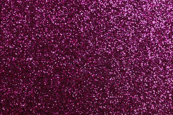 A close up of a purple glittery background. The image is full of sparkles and has a very bright and cheerful mood