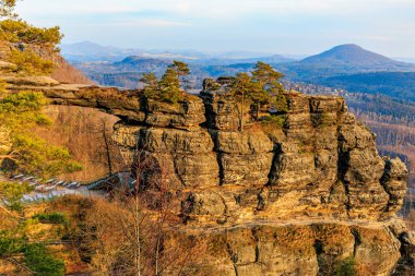 Majestic sandstone arch in the bohemian switzerland national park at sunrise.