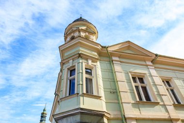 Historic european building with tower against blue sky.