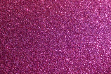 Pembe parlak bir arka plan yakın plan. Arka plan küçük pembe noktalardan oluşuyor.