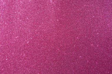 Bir sürü pembe noktalı pembe bir arka plan. Arka plan çok parlak ve noktalar çok küçük.