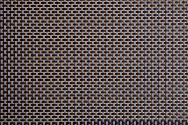 Geometrik tasarımı olan karmaşık siyah ve altın dokuma deseni.