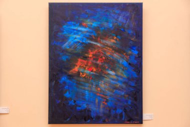 Ortasında kırmızı nokta olan mavi ve turuncu bir girdap resmi. Resim soyut ve bir hareket algısı var. 12 Mart 2024 Balti Moldova