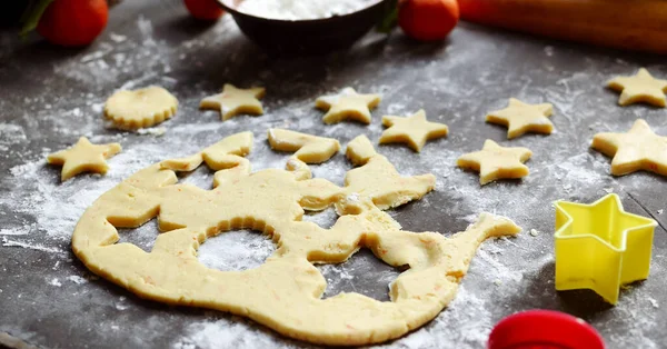 Cooking cookies for the new year and christmas. Flour and dough, cookie cutters. Top view. Copy space — Stock Photo, Image