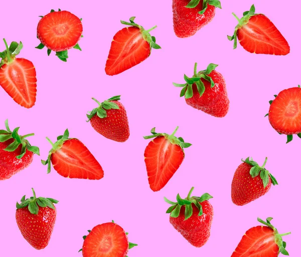 Strawberries on a pink background. Strawberry slices. Food pattern — Stock Photo, Image