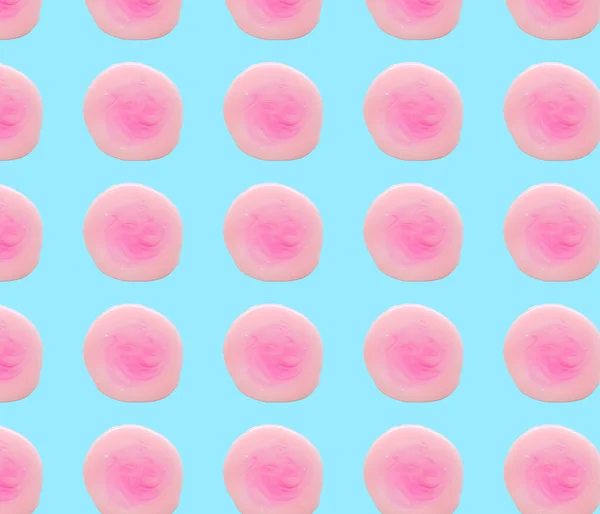 Pink liquid soap isolated on blue color. Abstraction of pink spots. Beautiful blots. Pattern — Stockfoto