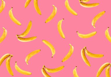 Pembe arka planda olgun muzlar. Muz deseni.