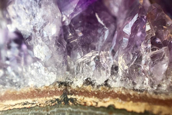 macro image of magenta, green and gold amethyst stone, magenta and green layers, semi precious minerals, natural texture and backgrounds, selective focus