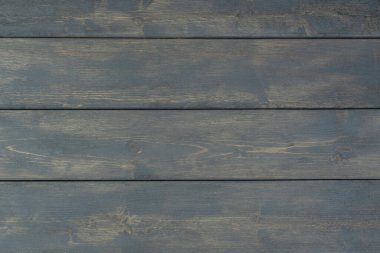 Düz tahtalardan yapılmış koyu gri ahşap arka plan, ahşap doku, kırsal stil, metin için kopyasal alan. Doğal desenler konsepti.