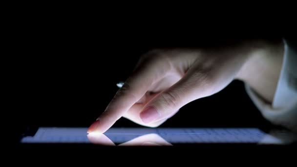 Female Hand on the Ipad Screen in the Dark — Stock Video