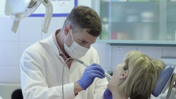 Close Up The Doctor Conducts The Procedure In The Dental Office — Stock Video