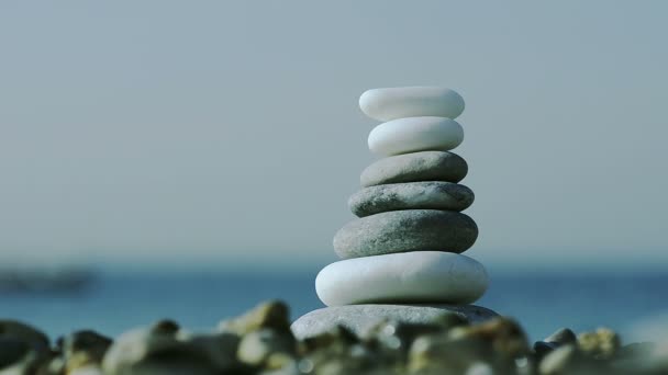 Close Up of pebbles stack on sea background — Stock Video