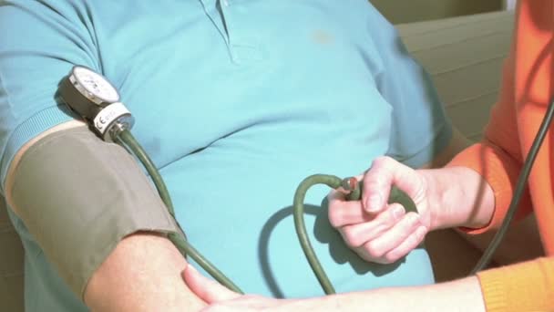 Nurse Checks Senior Blood Pressure — Stock Video