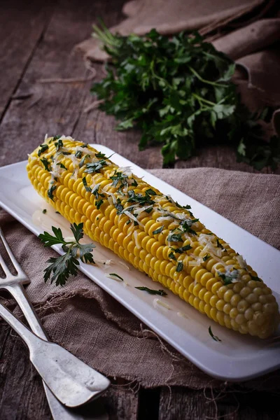 Boiled corn with parmesan and parsley — Stock Photo, Image