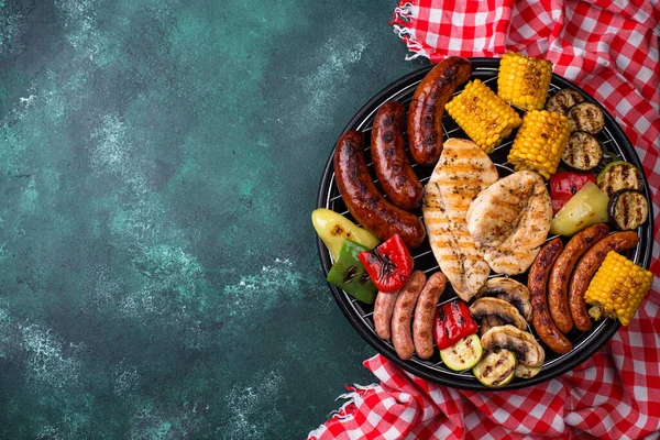 Grilled sausages, meat, and vegetables. — Stock Image Grilled sausages, meat, and vegetables. Stock Photo