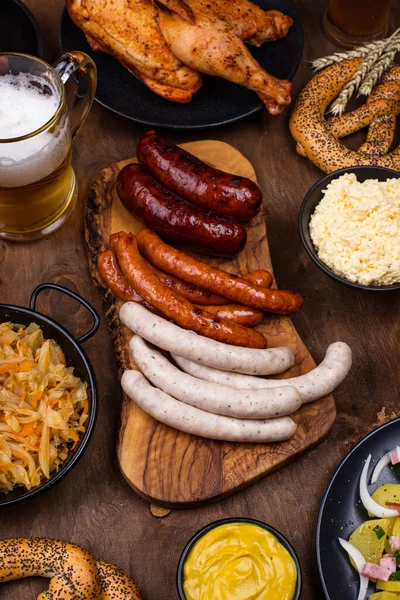 Oktoberfest dishes with beer, pretzel and sausage — Stock Photo, Image