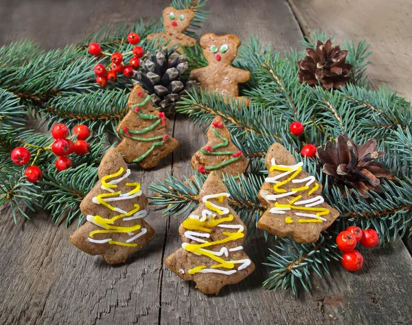 Christmas gingerbread cookies on wooden background — Stock Photo, Image