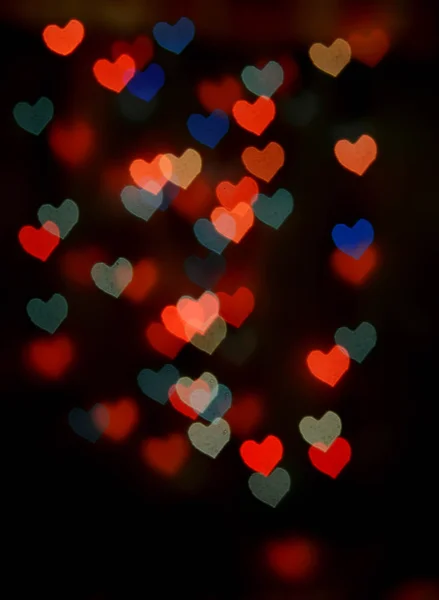 Abstrakt festliga hjärtat bokeh bakgrund — Stockfoto