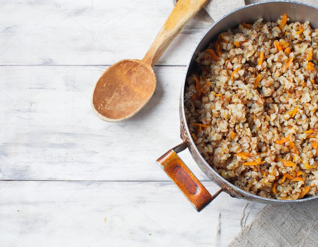 Buckwheat with carrots in light background 