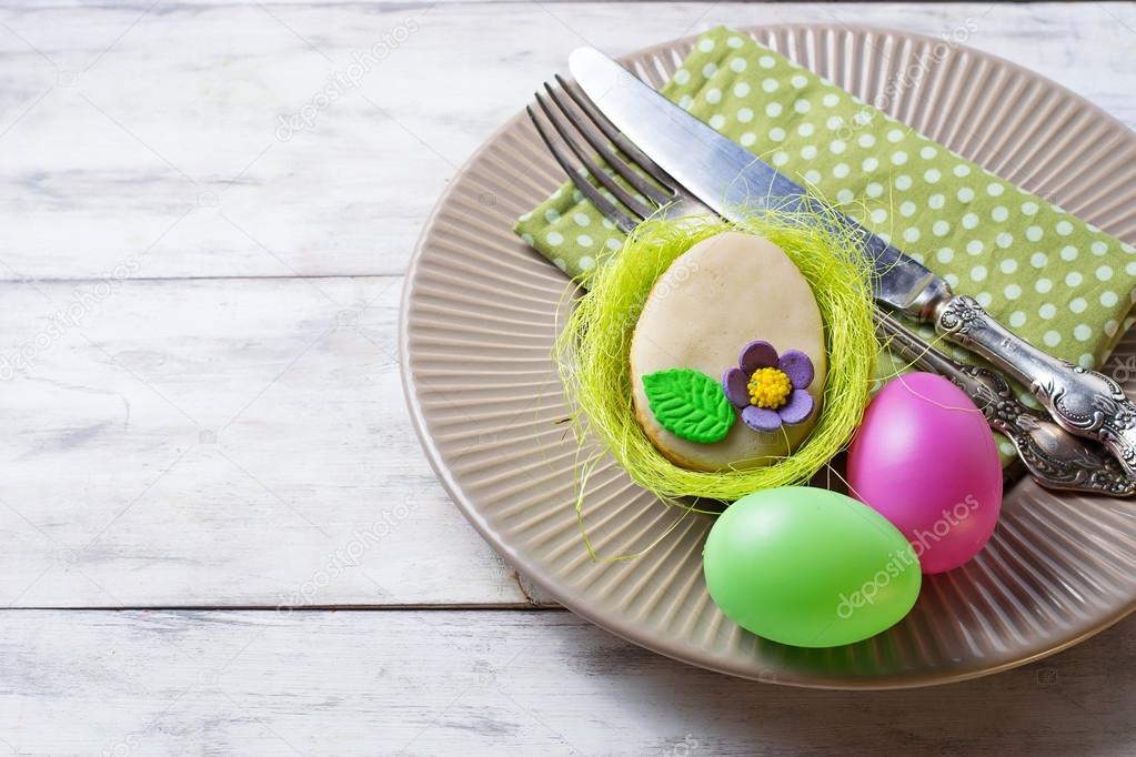 Easter table setting with cookie in shape of egg