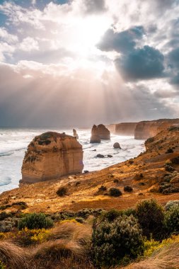 Beautiful sunlight over the famous 12 Apostles rocks in Victoria, Australia clipart