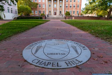 Chapel Hill, NC / USA - October 21, 2020: The University of North Carolina Chapel Hill Seal in brick walk way. clipart