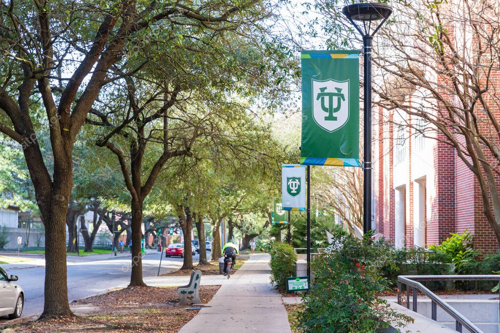 New Orleans, LA - 2021: Sidewalk on campus of Tulane University with logo on banners