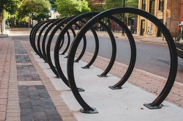Empty circular bike rack on an empty street during summer 2020 in the Exchange District in Winnipeg Manitoba, Canada