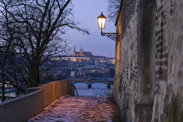 street lantern from street lighting on the wall from 1727 of the old fortress Vysehrad from year in the center of Prague at sunset in winter