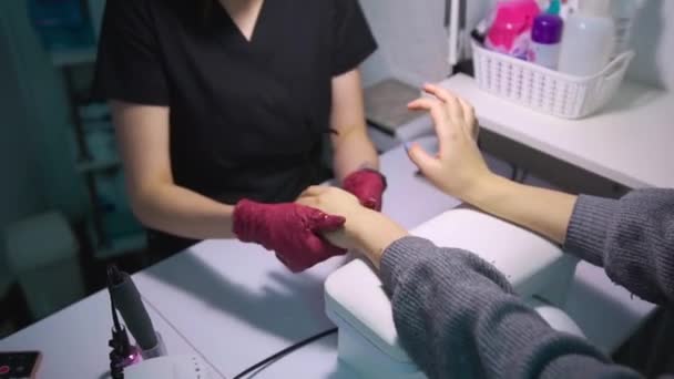 Manicurist Beauty Salon Has Finished Work Rubs Cream Client Hands — Stock Video