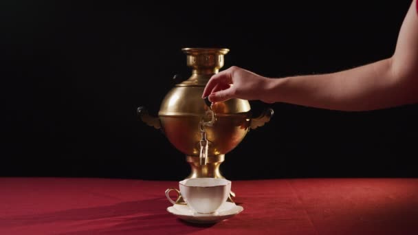 Woman Puts Ceramic Cup Saucer Spout Samovar Her Hand Collects — Stock Video