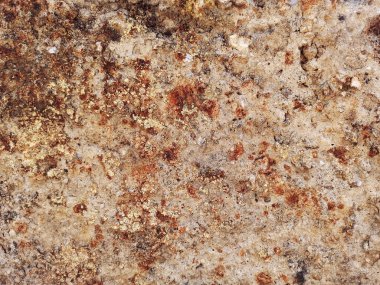 Kum taşı dokusu. Paslı kaya. Olaysız, sert kaya yüzeyi. Soyut, bej taşın doğal arkaplanı. Yüksek kalite fotoğraf. Yatay yakın plan