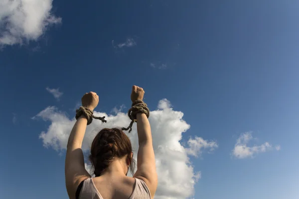 Hands bound by rope — Stock Photo, Image