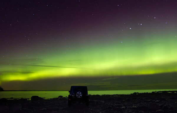 Northern lights on lake Ladoga, Russia, November 03, 2015, travel by Jeep Wrangler
