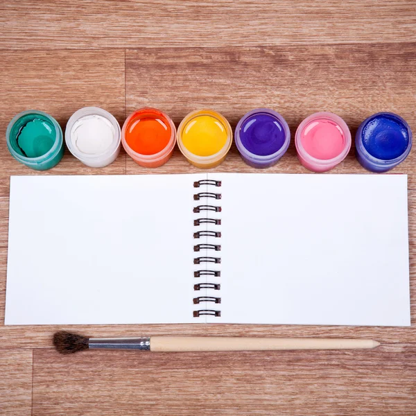 Items for drawing on the wooden background — Stock Photo, Image