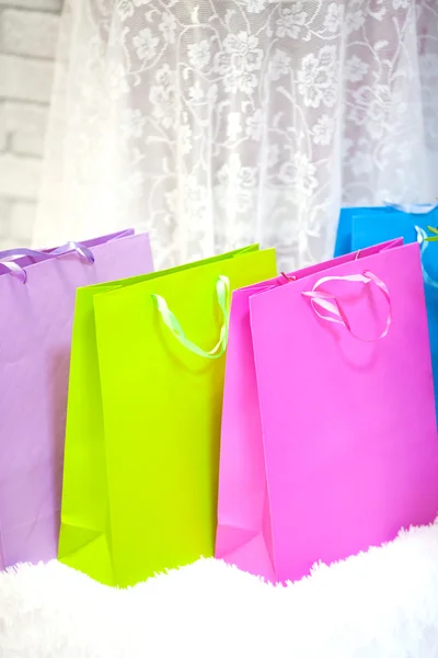 Many brightly colored packets in the room. Shopping — Stock Photo, Image