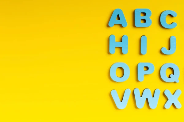 Blue Letters Yellow Background — 스톡 사진