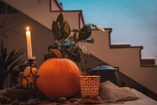 Halloween Pumpkin Candle Lit Table Skeleton Candles Nuts Teal Orange — Stock Photo, Image