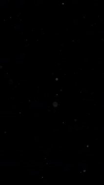 Parıldayan parçacıklar soyut dalga desenleri oluşturuyor. Yüksek kalite 4k görüntü