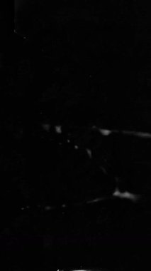 Dikey eski analog film dokusu titreyen ışık ve sıkıntılı sınırlar. Yüksek kalite 4k görüntü