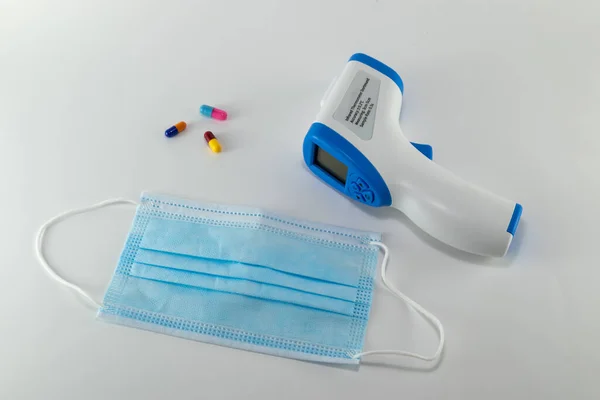 thermometer and mask essential for protection against covid 19